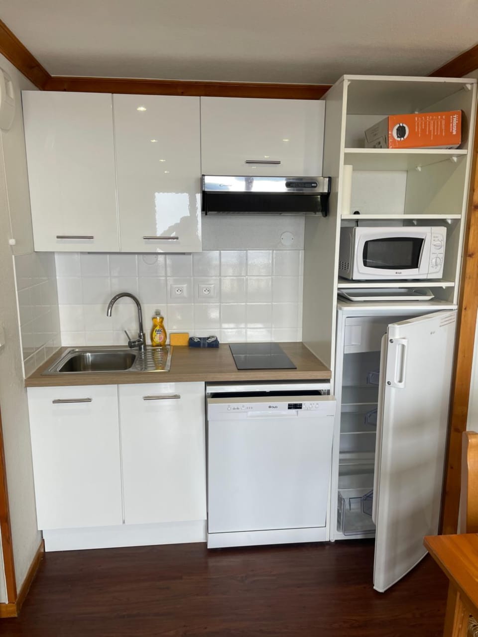 Kitchen or kitchenette, dishwasher, microwave, oven, stove