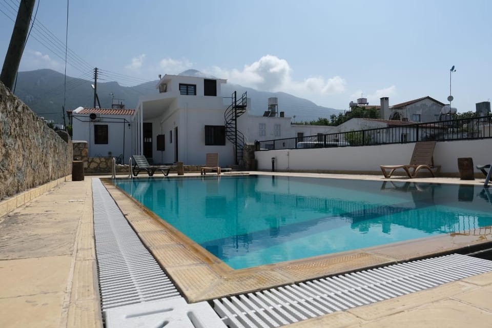 Property building, Natural landscape, Mountain view, Pool view, Swimming pool, sunbed