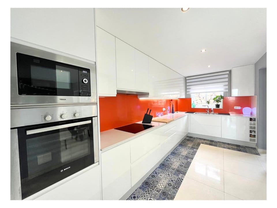 Kitchen or kitchenette, dishwasher, oven, stove
