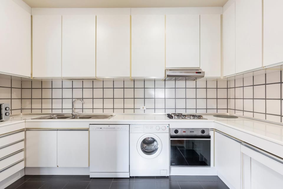 Kitchen or kitchenette, dishwasher, oven, stove, washing machine