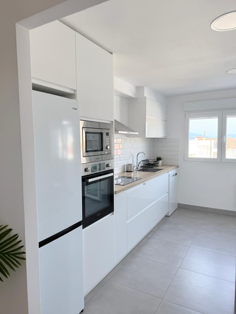 Kitchen or kitchenette, dishwasher, oven, stove, toaster