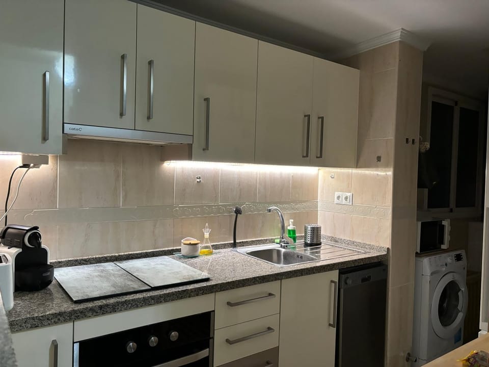 Kitchen or kitchenette, dishwasher, stove, toaster, washing machine