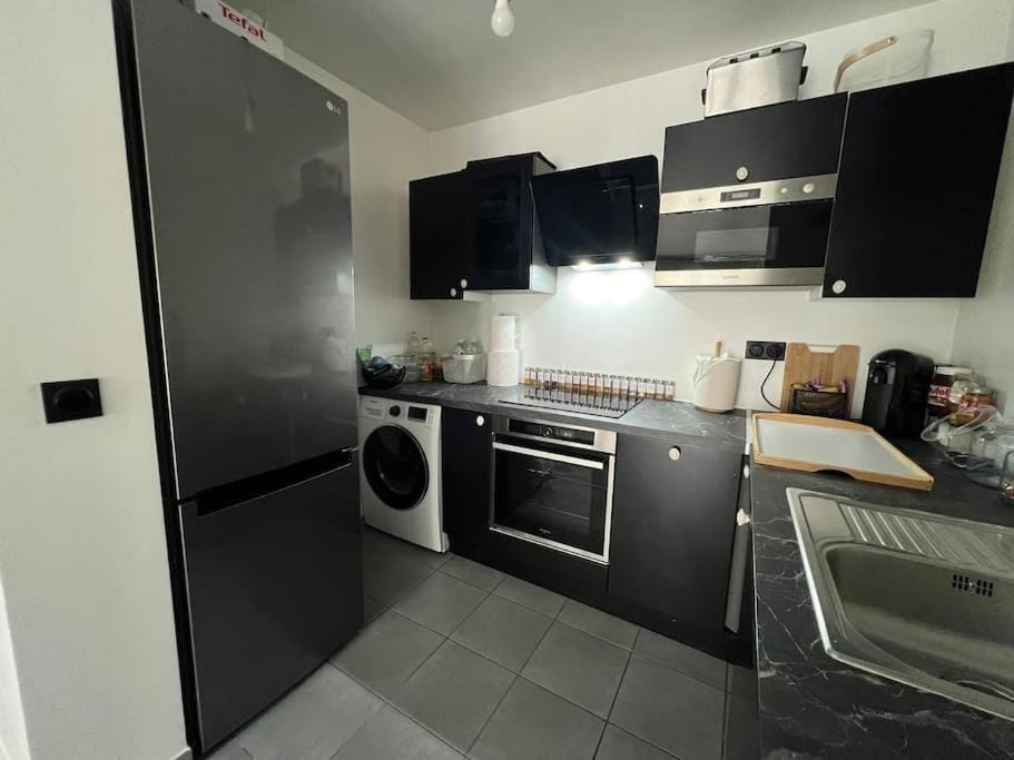 Kitchen or kitchenette, dishwasher, oven, stove, washing machine