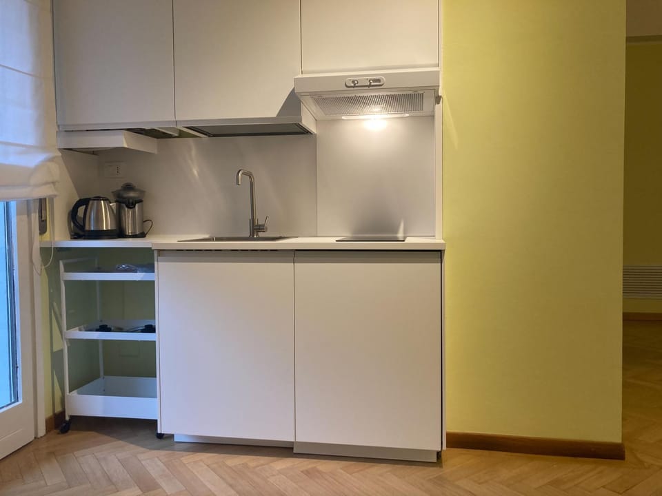 Kitchen or kitchenette, microwave, stove, toaster