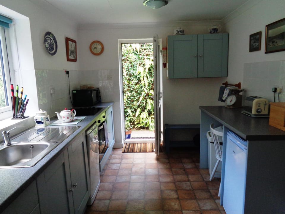 Kitchen or kitchenette, dishwasher, oven, stove, toaster