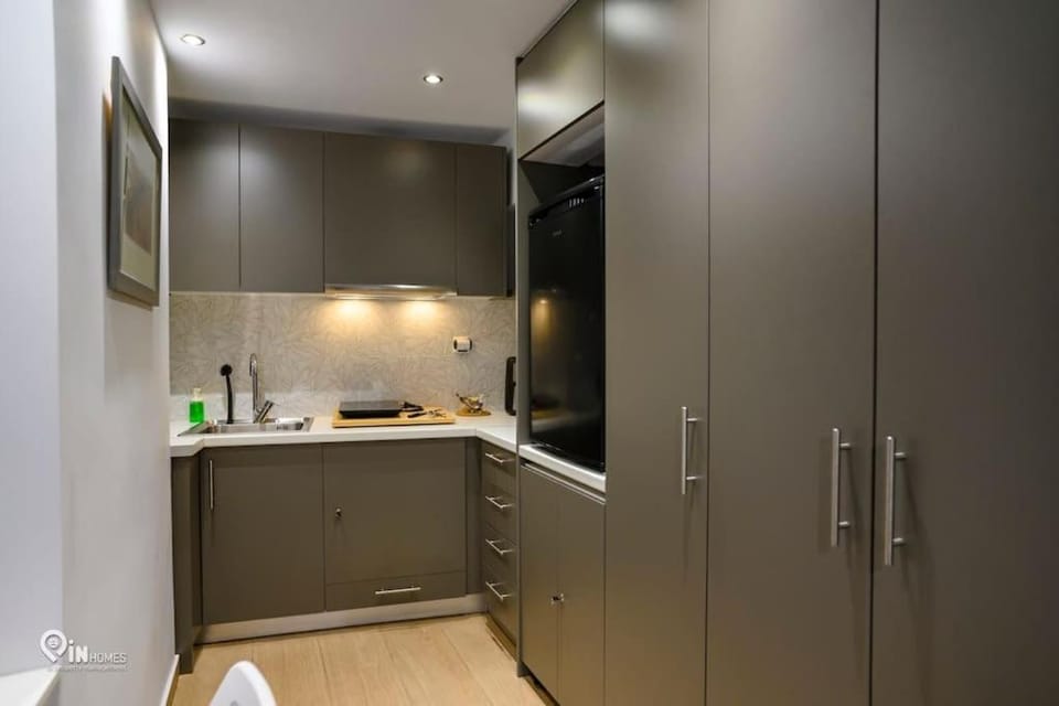 Kitchen or kitchenette, stove, wardrobe