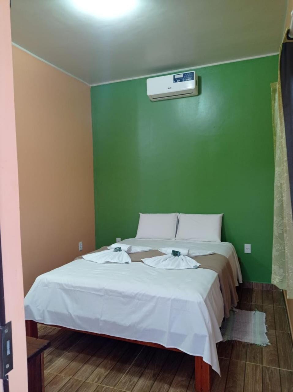 Property building, Bed, Decorative detail, Decorative detail, towels, towels, air conditioner, air conditioner