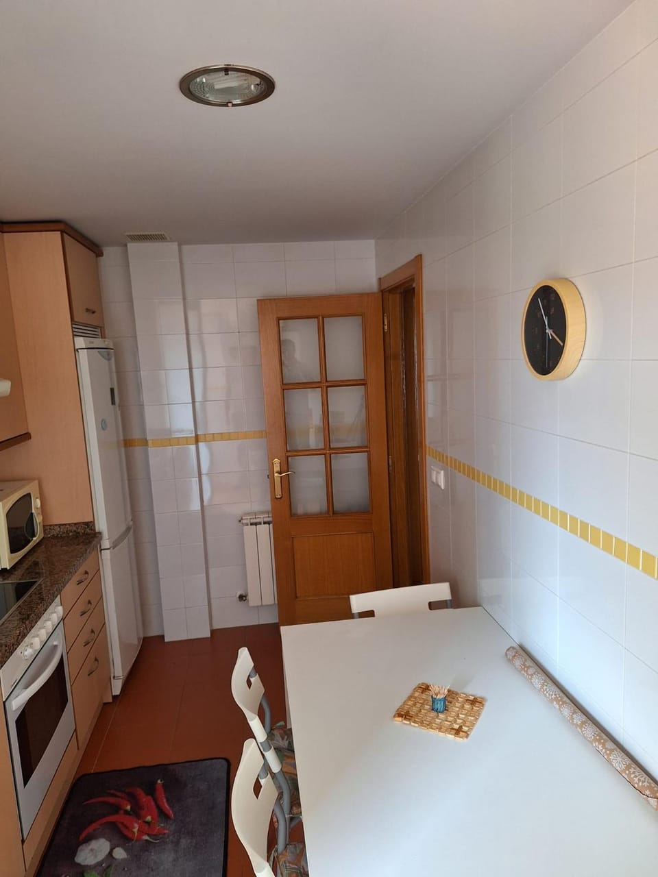 Kitchen or kitchenette, microwave, oven, stove