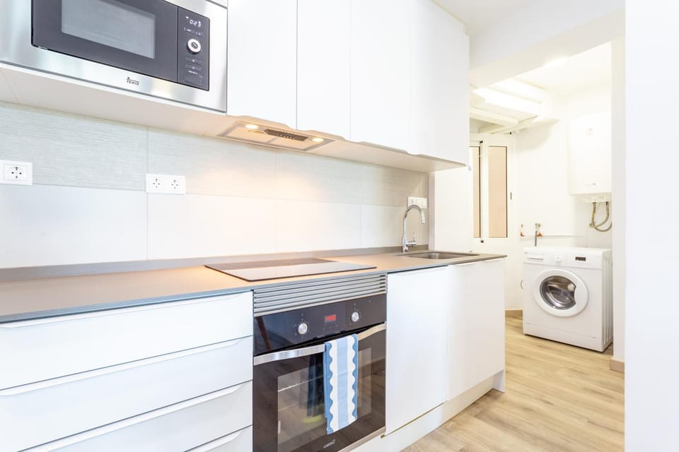 Kitchen or kitchenette, dishwasher, microwave, oven, washing machine