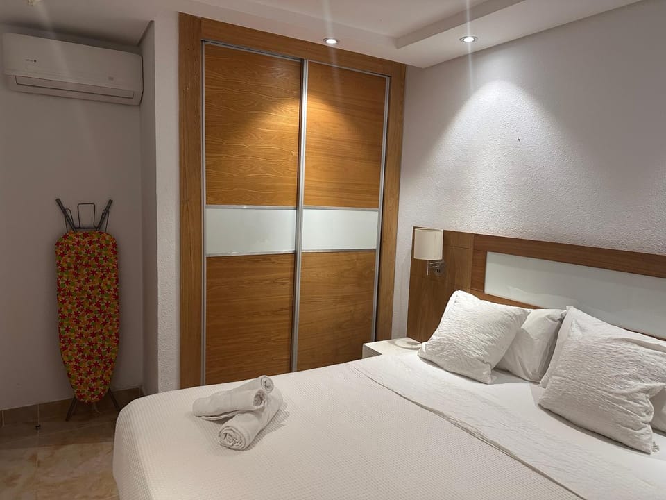 Bed, flat iron, wardrobe