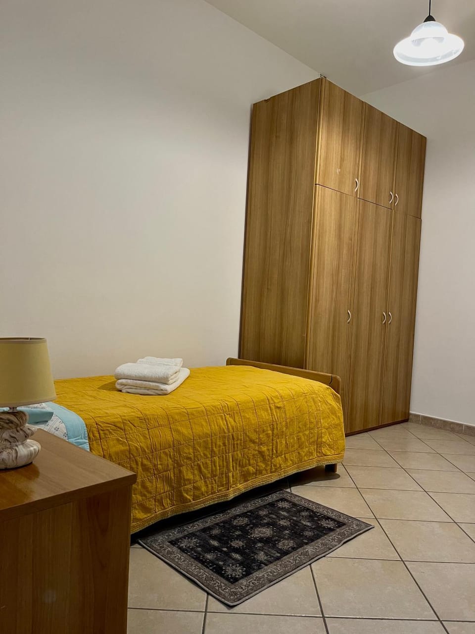Bed, locker, towels
