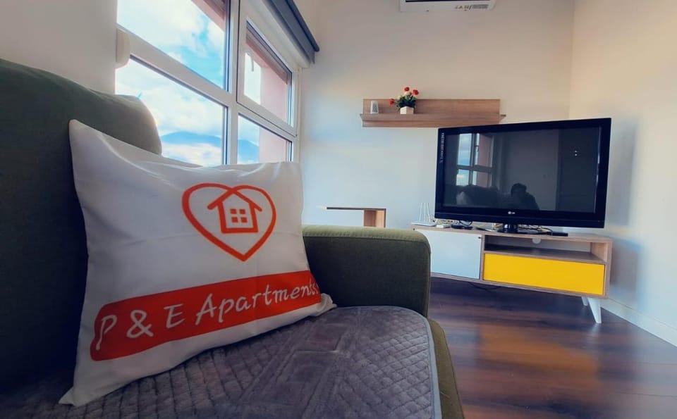 Property logo or sign, TV and multimedia, Living room, Seating area