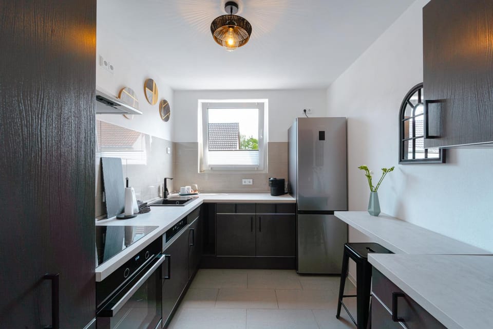 Kitchen or kitchenette, dishwasher, oven, stove