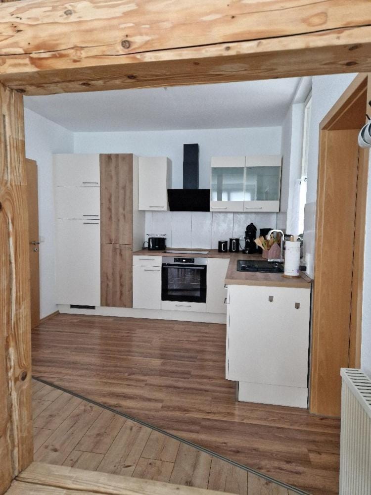 Kitchen or kitchenette, dishwasher, oven, stove, toaster
