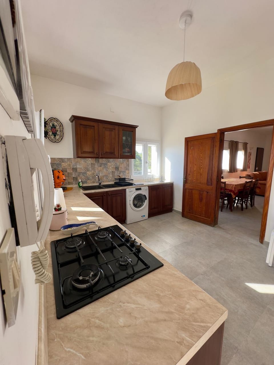 Kitchen or kitchenette, oven, stove, washing machine, dryer