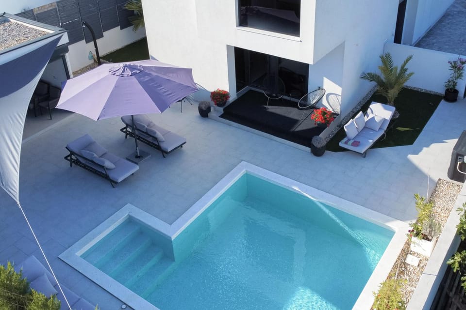 Property building, Pool view, Swimming pool, sunbed