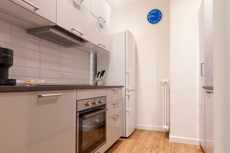 Kitchen or kitchenette, dishwasher, oven, stove
