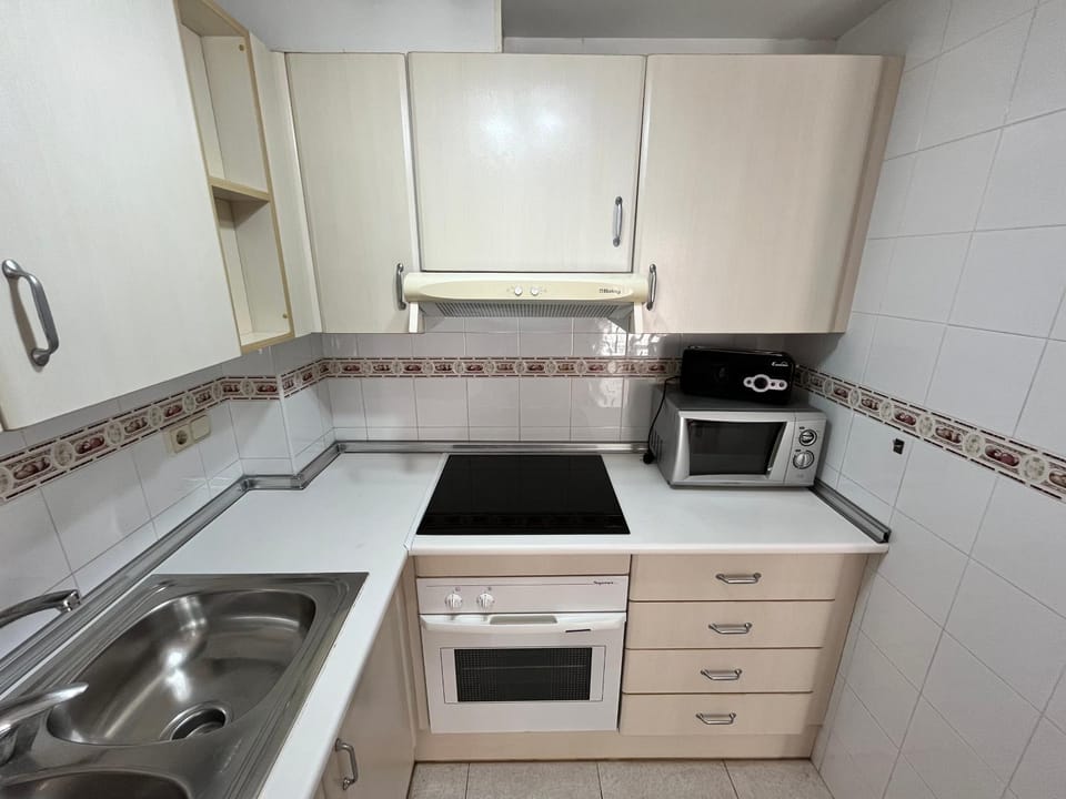 Kitchen or kitchenette, stove