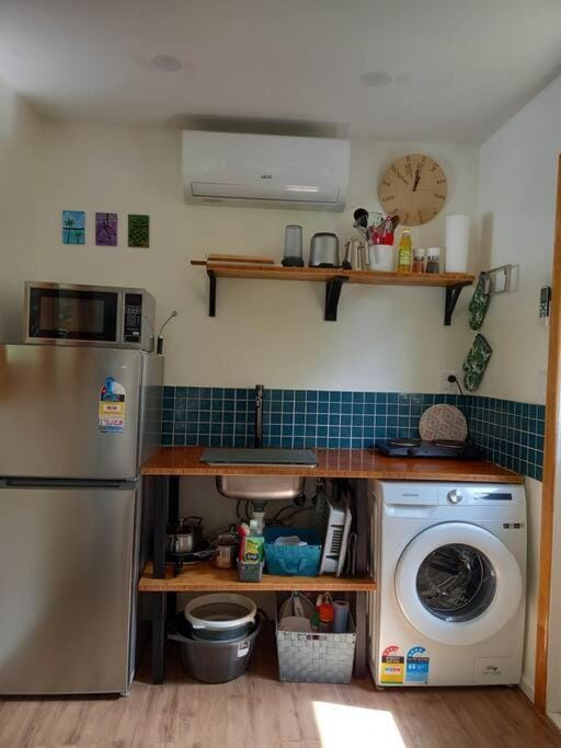 Kitchen or kitchenette, washing machine