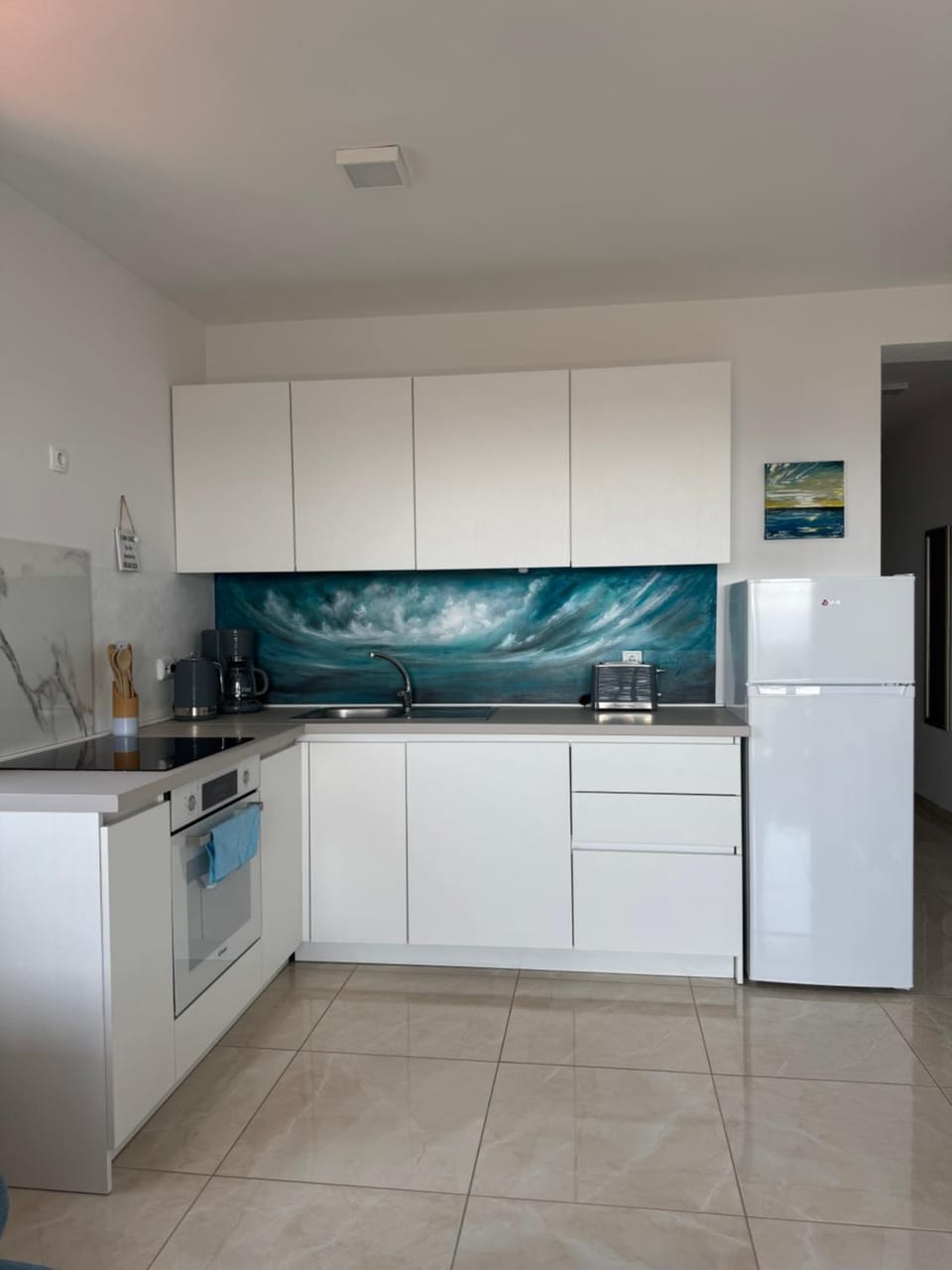 Kitchen or kitchenette, dishwasher, oven, stove