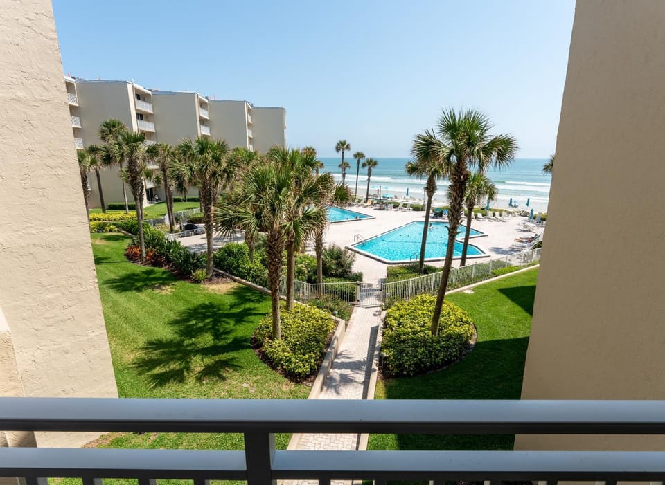 Property building, Patio, Nearby landmark, Day, Natural landscape, View (from property/room), Balcony/Terrace, Beach, Pool view, Sea view, Swimming pool, sunbed