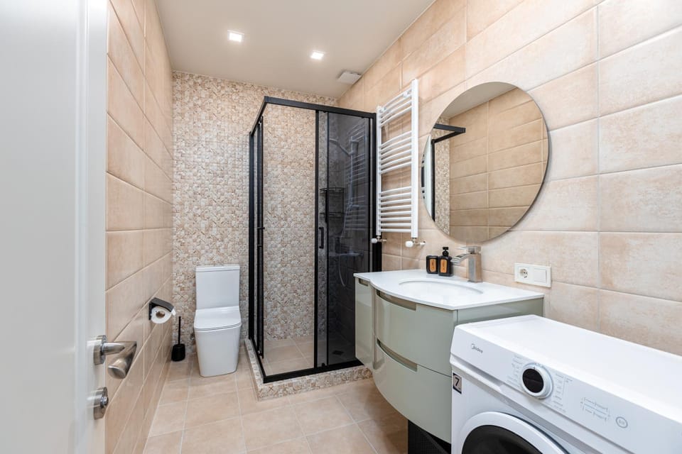 Shower, Toilet, Bathroom, towels, washing machine, dryer