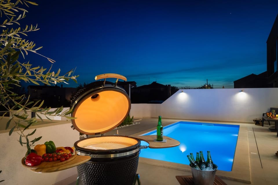 Patio, Night, BBQ facilities, Pool view, Swimming pool