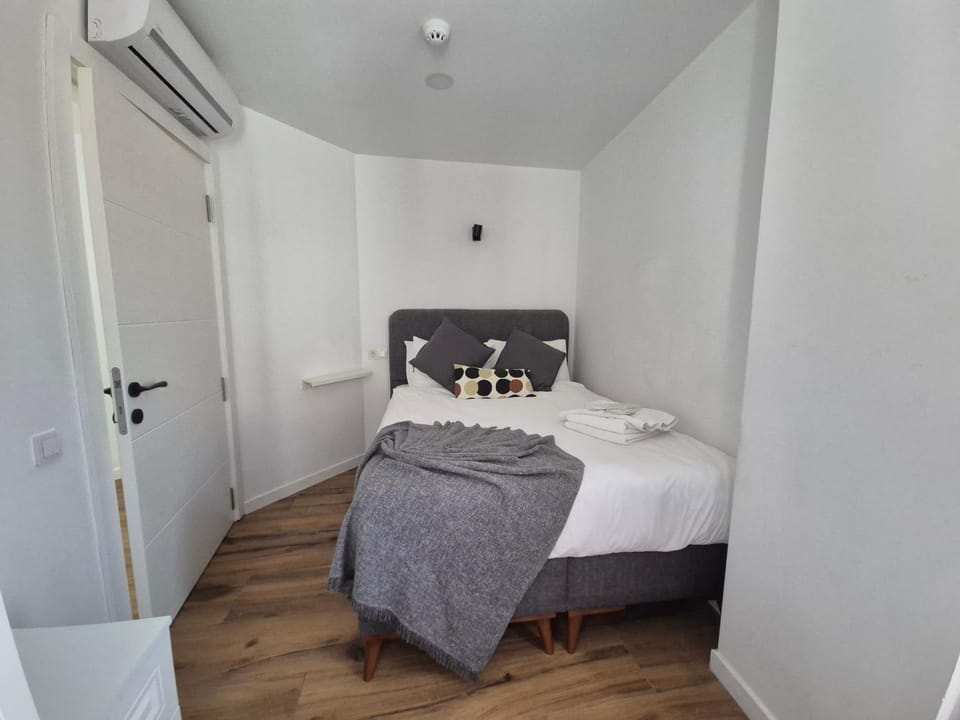 Bed, Bedroom, towels, wardrobe, air conditioner