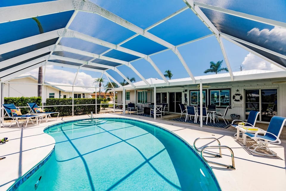 Spacious Waterfront Escape with Sun-Soaked Pool and Dock House in Punta Gorda
