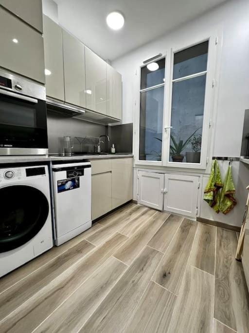 Kitchen or kitchenette, dishwasher, oven, stove, washing machine, dryer