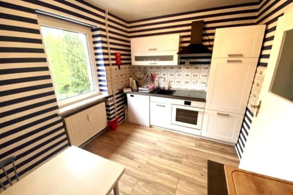 Kitchen or kitchenette, dishwasher, oven, stove