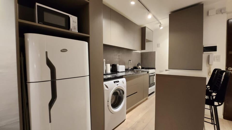 Kitchen or kitchenette, toaster, washing machine