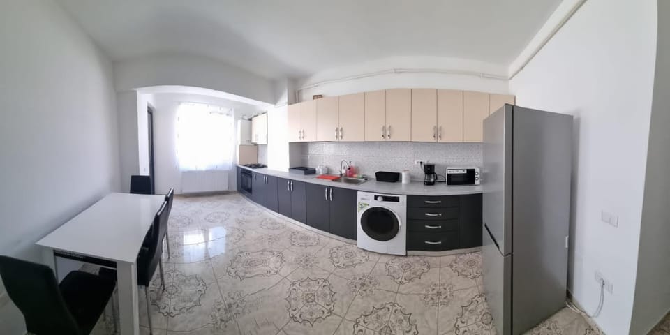 Kitchen or kitchenette, oven, stove, toaster, washing machine