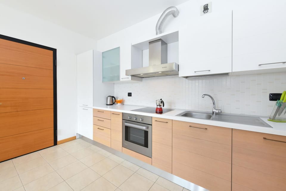 Kitchen or kitchenette, dishwasher, oven, stove