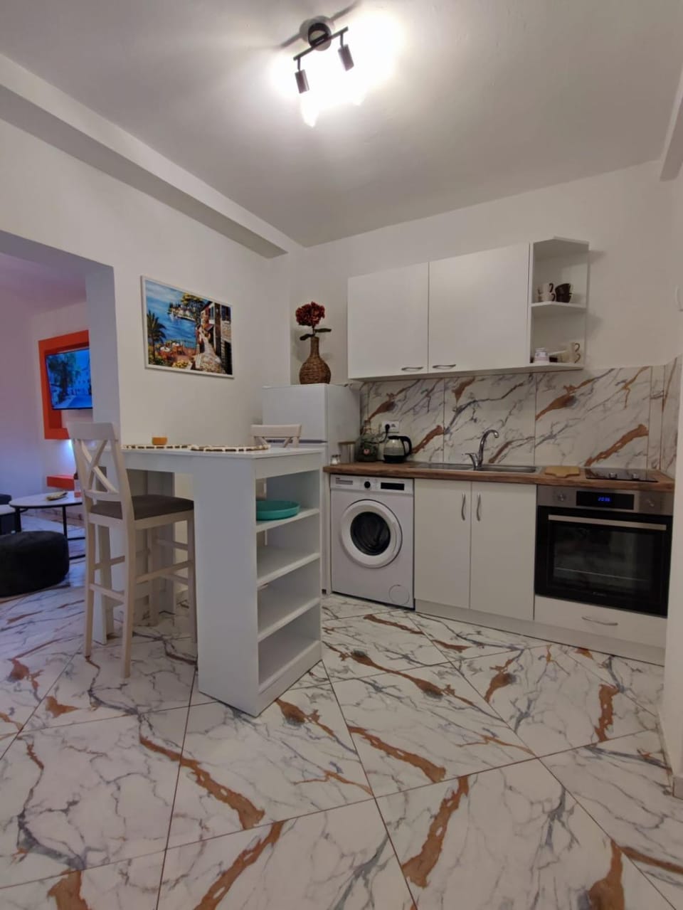 Kitchen or kitchenette, Dining area, oven, stove, washing machine