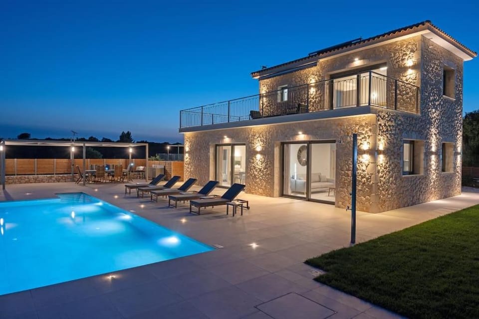 Property building, Patio, Night, Pool view, Swimming pool, sunbed