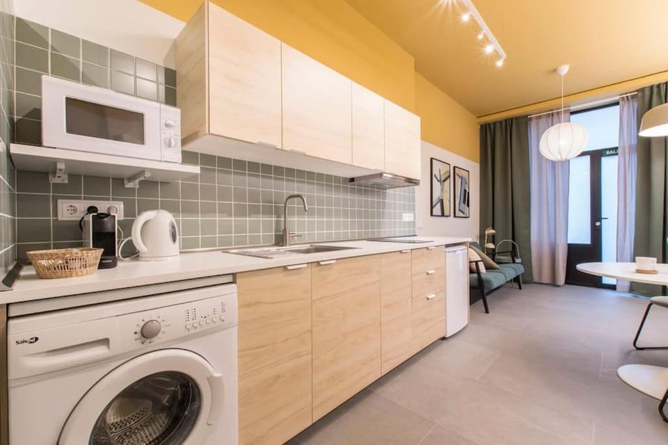 Kitchen or kitchenette, stove, toaster, washing machine