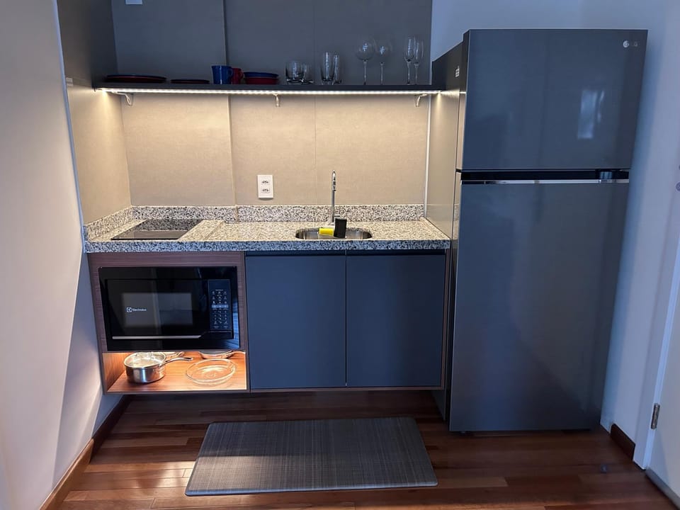 microwave, minibar, stove, kitchen