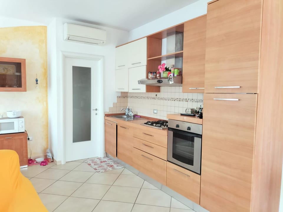 Kitchen or kitchenette, dishwasher, oven, stove