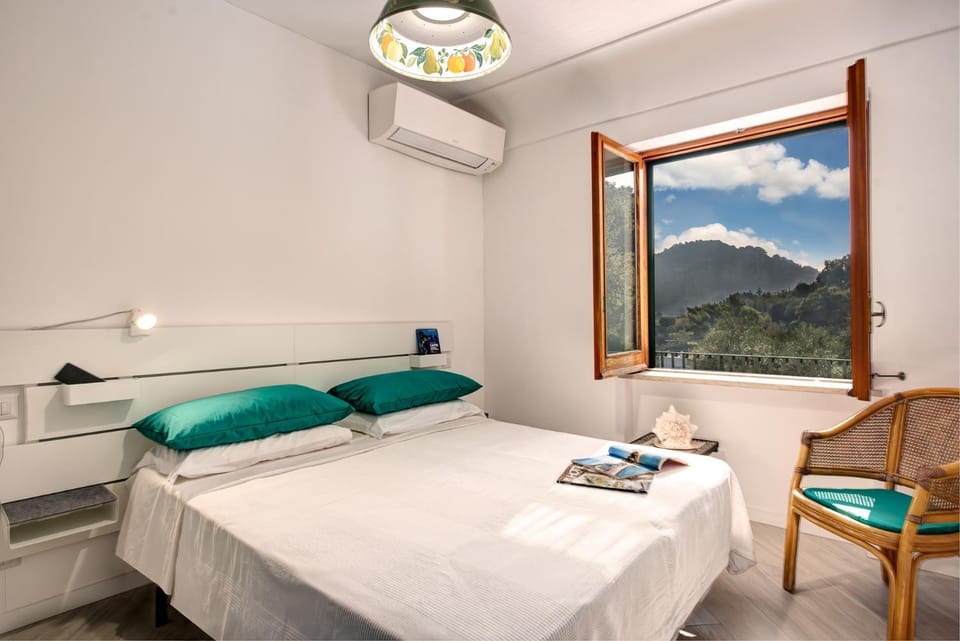 Bed, Natural landscape, Mountain view, towels, air conditioner