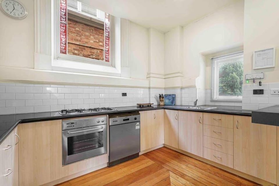 Kitchen or kitchenette, dishwasher, oven, stove