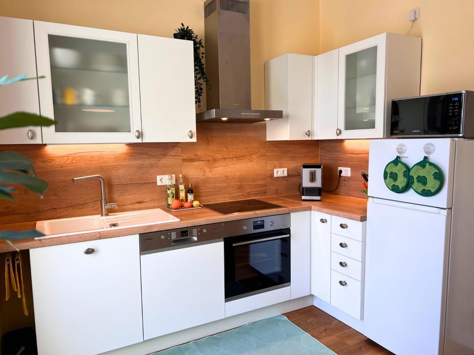 Kitchen or kitchenette, dishwasher, microwave, oven, stove, kitchen