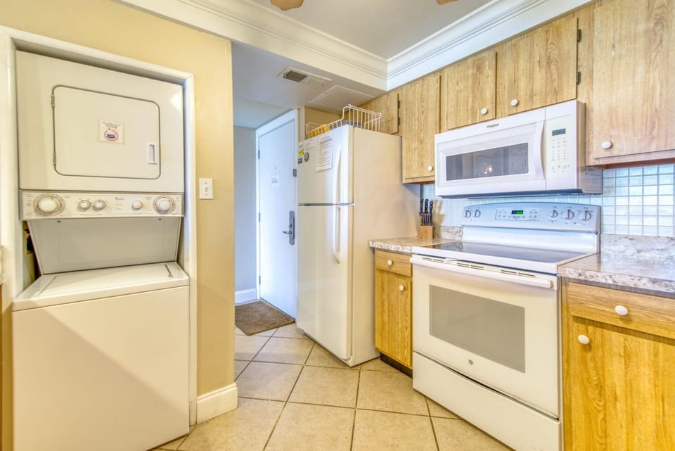 Kitchen or kitchenette, oven, stove, washing machine, dryer