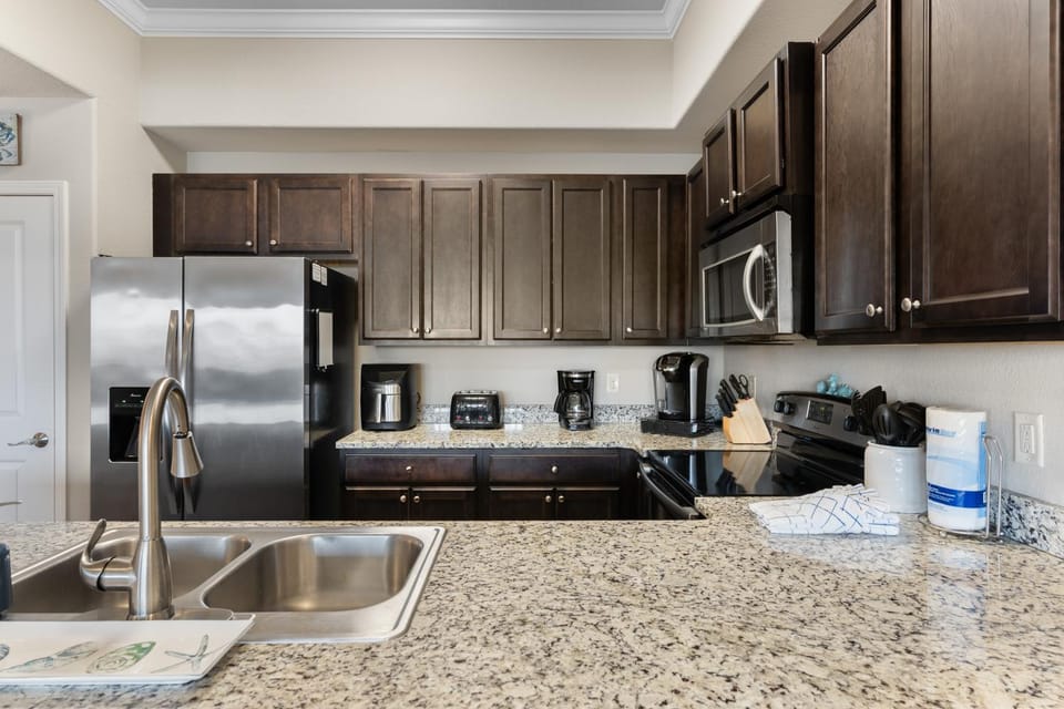 Kitchen or kitchenette, dishwasher, oven, stove, toaster