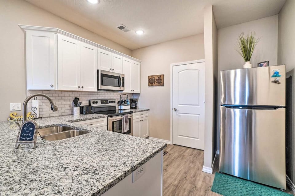 Kitchen or kitchenette, dishwasher, oven, stove, toaster