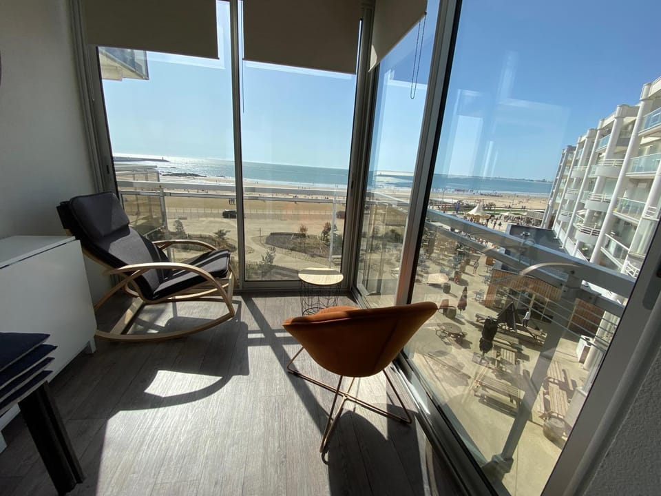 Patio, Natural landscape, View (from property/room), Living room, Seating area, Dining area, Beach, Sea view
