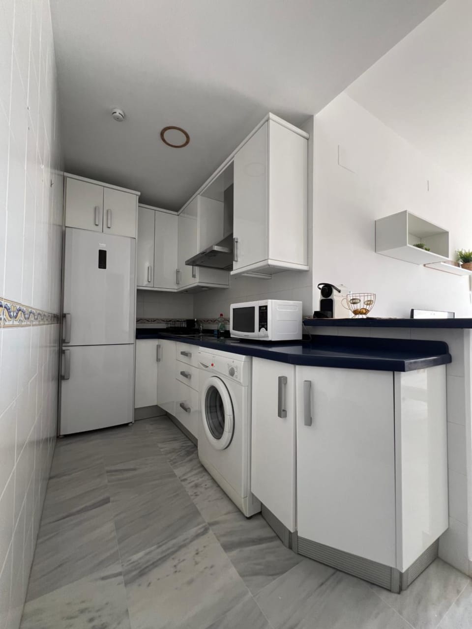 Kitchen or kitchenette, stove, washing machine