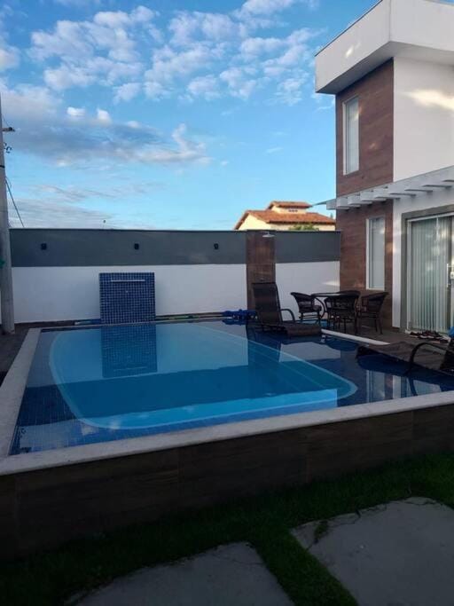 Property building, Patio, Natural landscape, Pool view, Swimming pool, sunbed