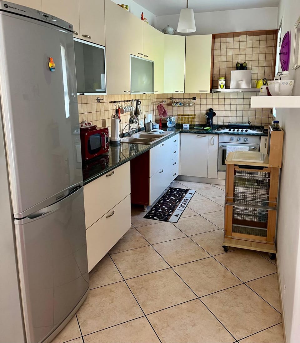 Kitchen or kitchenette, microwave, oven, stove