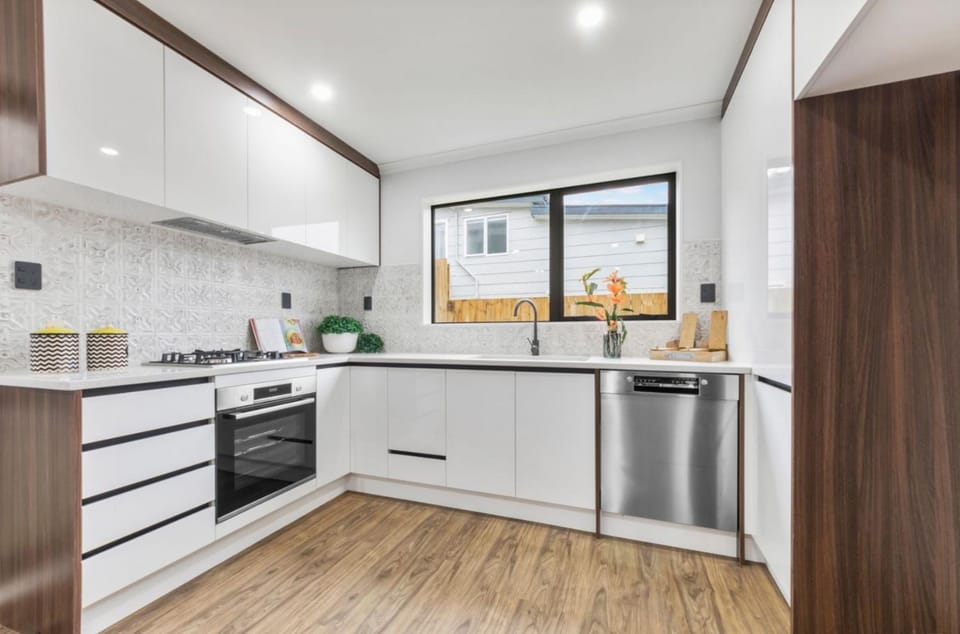 Kitchen or kitchenette, dishwasher, oven, stove